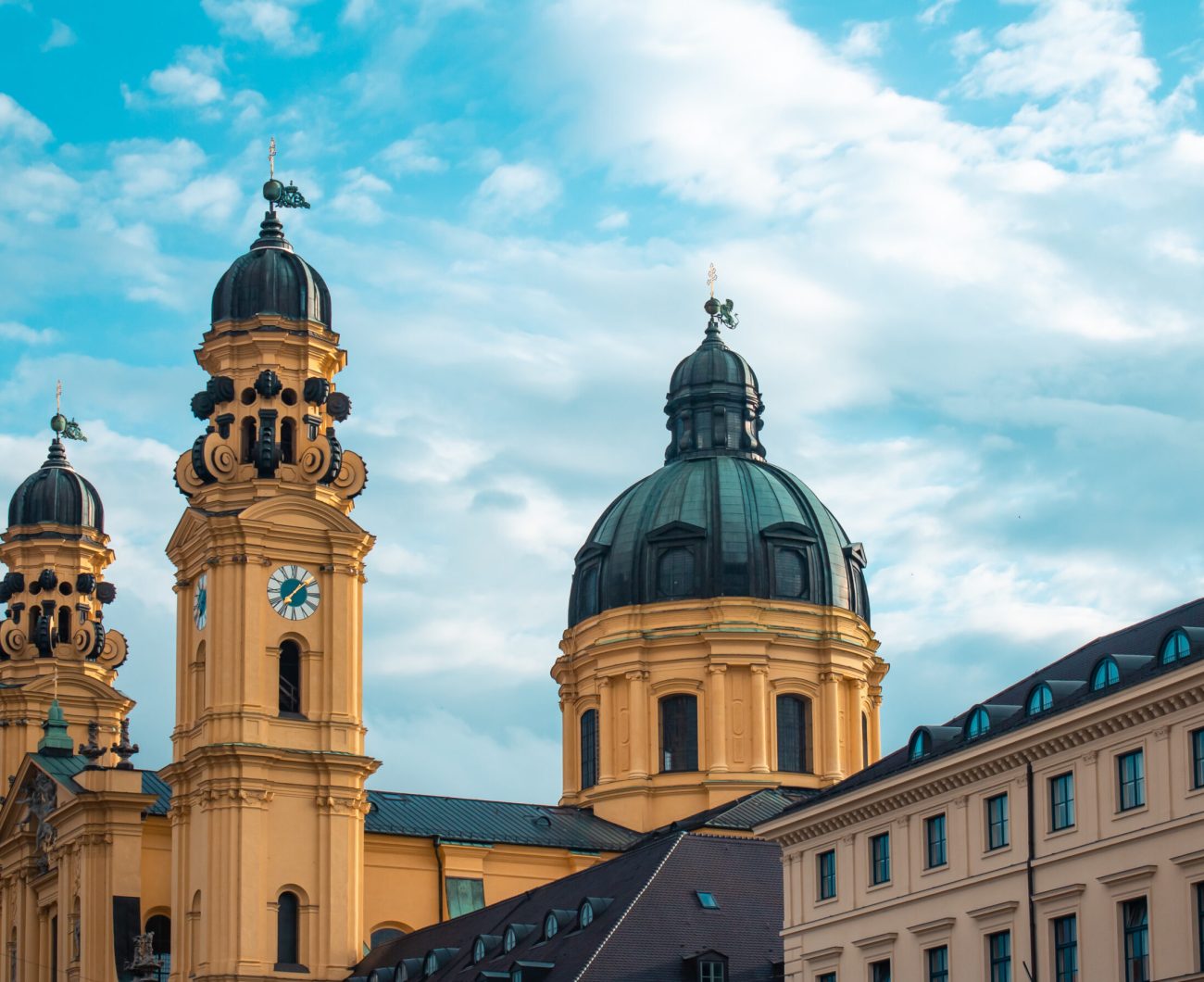 theatine-church-sunlight-cloudy-sky-munich-germany